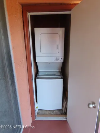 a view of a room with a wardrobe space
