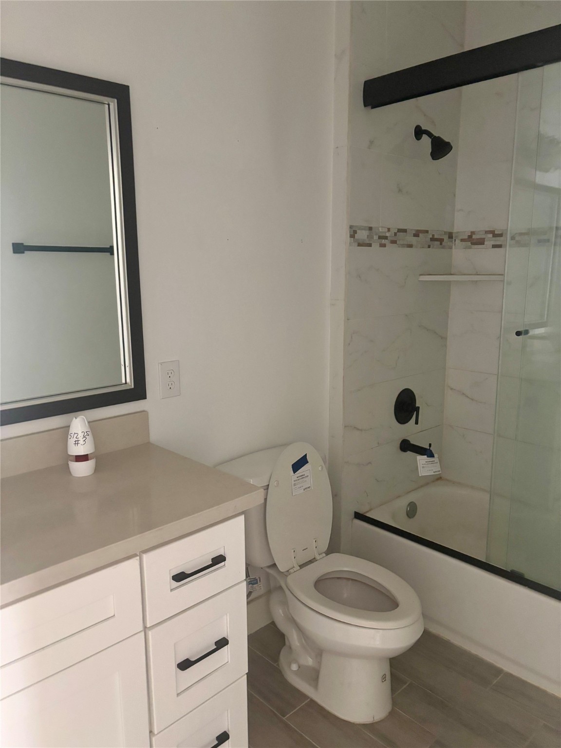 262 Coral Gables Trinity, TX 75862 - Photo 5 of 8 a bathroom with a granite countertop toilet sink and mirror