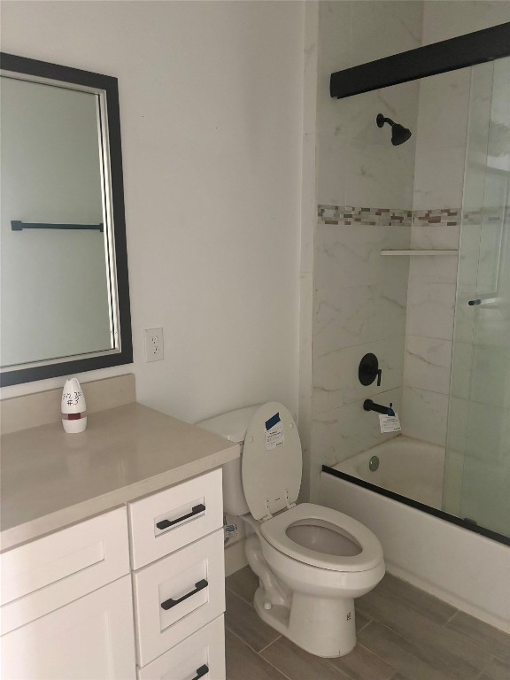 262 Coral Gables Trinity, TX 75862 - Photo 5 of 8 a bathroom with a granite countertop toilet sink and mirror