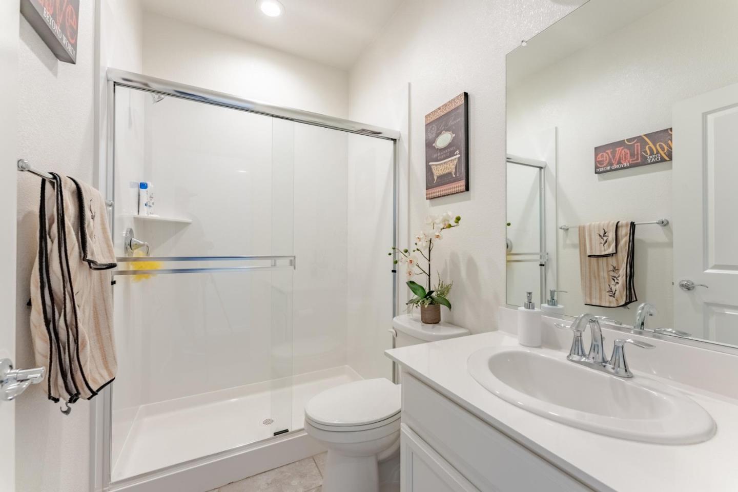 767 Sullivan Way Gilroy, CA 95020 - Photo 13 of 37 a bathroom with a sink toilet and shower