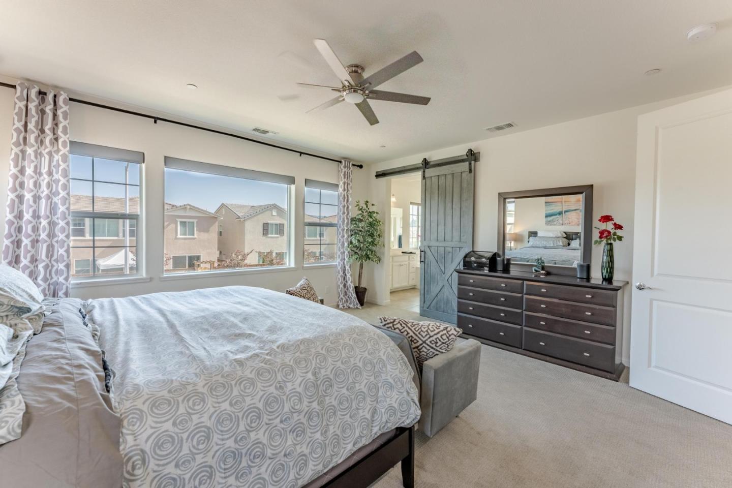 767 Sullivan Way Gilroy, CA 95020 - Photo 17 of 37 a bed room with a bed and a large window