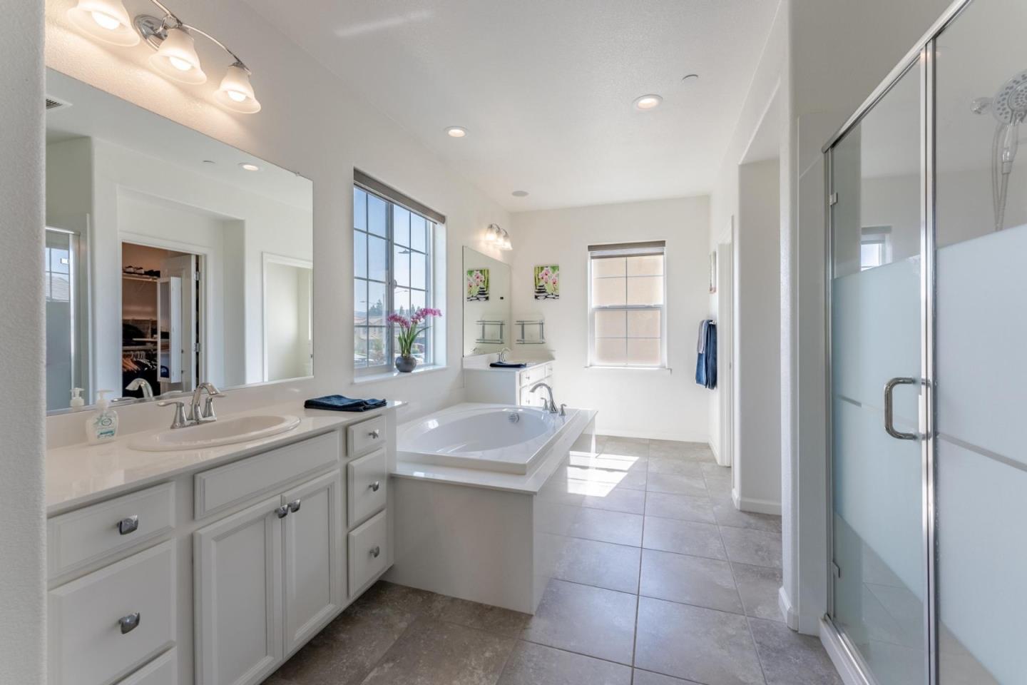 767 Sullivan Way Gilroy, CA 95020 - Photo 20 of 37 a bathroom with a granite countertop sink mirror and double