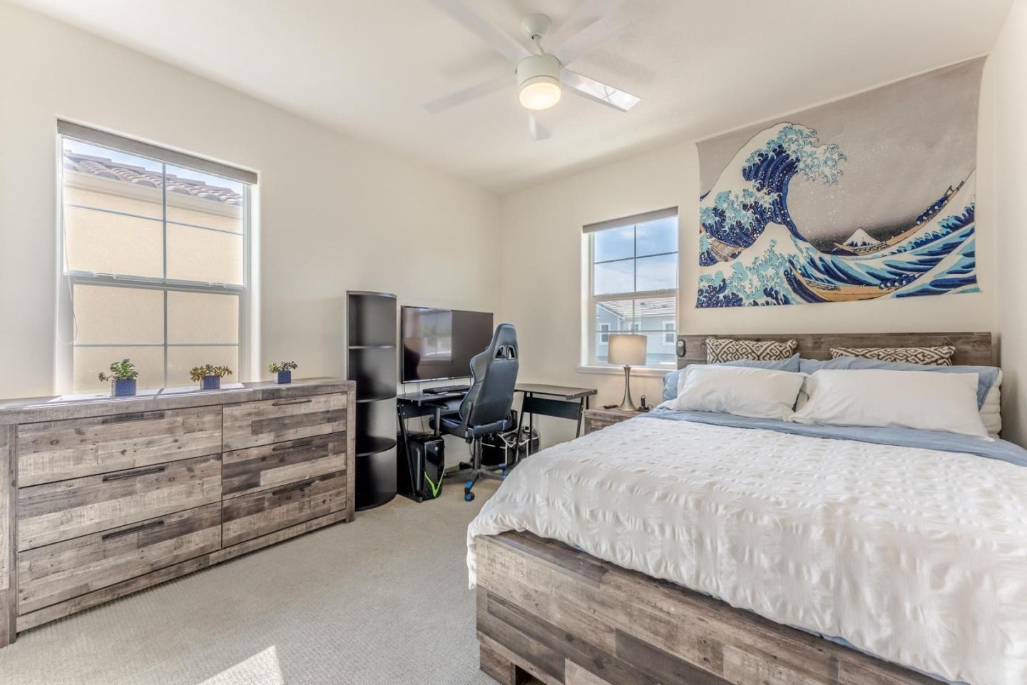 767 Sullivan Way Gilroy, CA 95020 - Photo 23 of 37 a bedroom with a bed and furniture