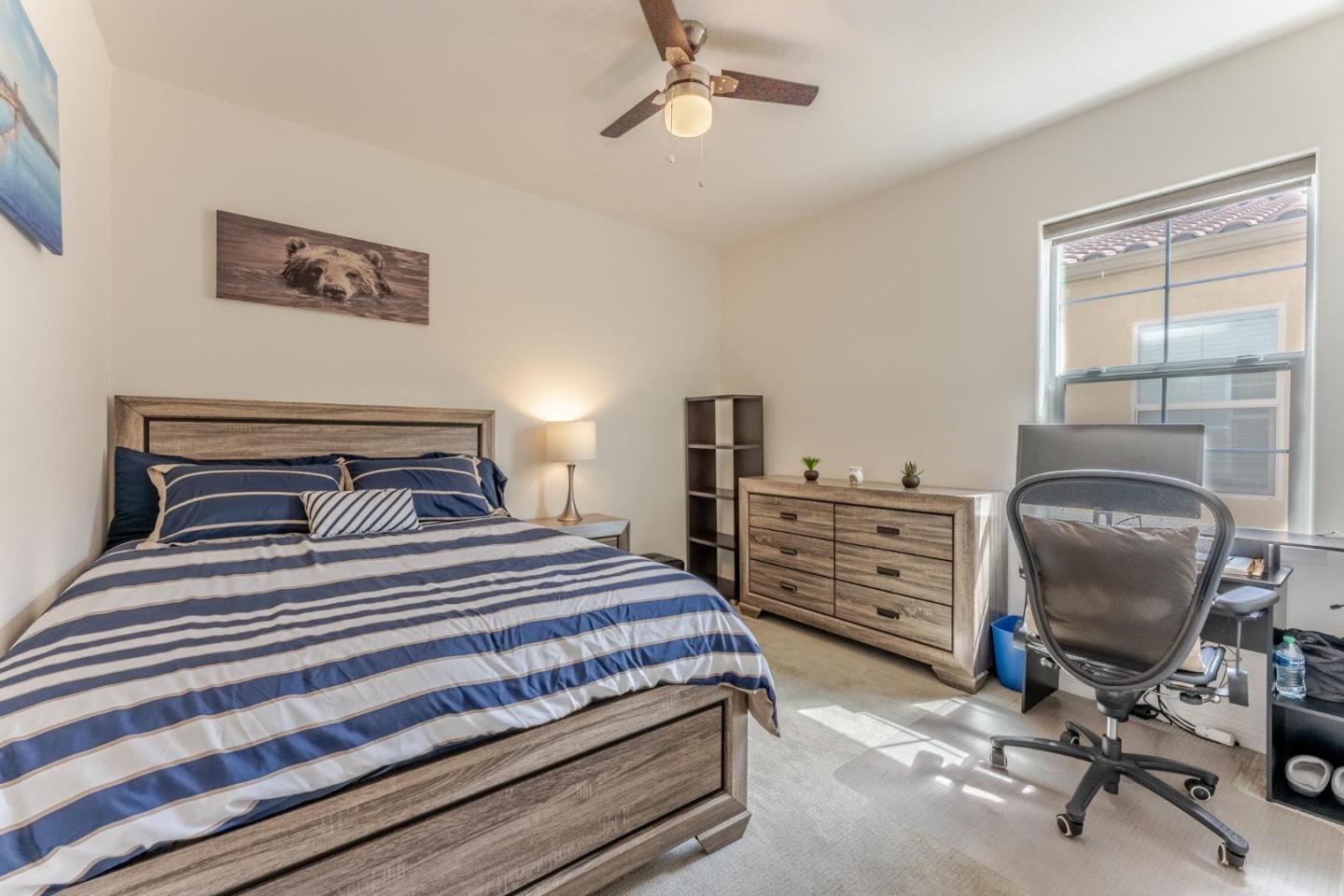 767 Sullivan Way Gilroy, CA 95020 - Photo 24 of 37 a bedroom with a bed and a desk