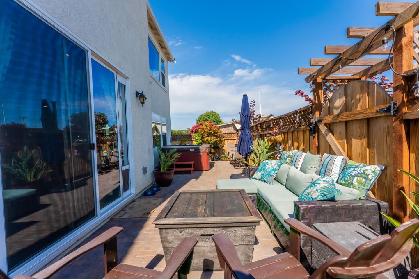 767 Sullivan Way Gilroy, CA 95020 - Photo 27 of 37 a view of a patio with couches table and chairs and potted plants