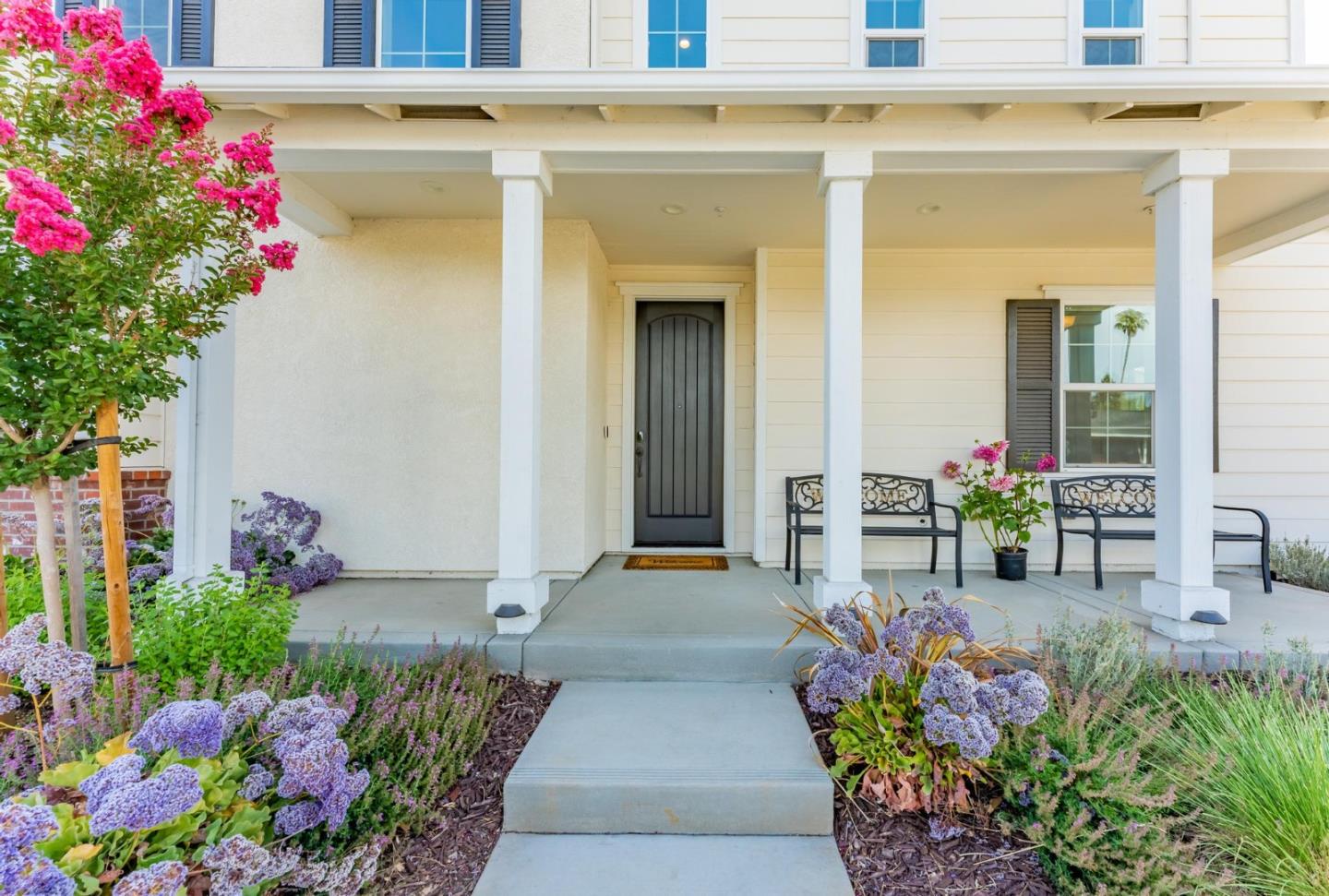 767 Sullivan Way Gilroy, CA 95020 - Photo 3 of 37 a front view of a house with flowers