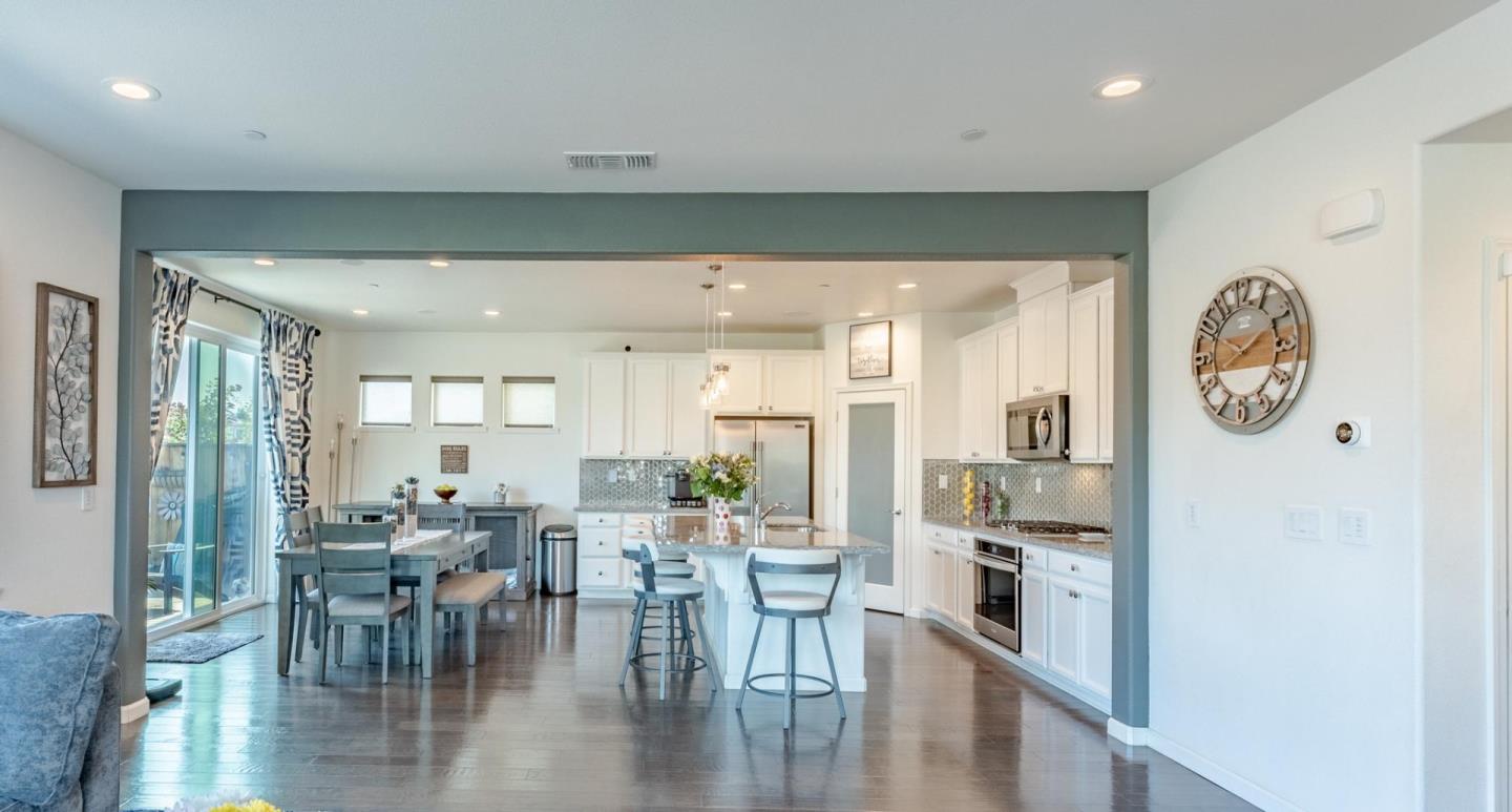 767 Sullivan Way Gilroy, CA 95020 - Photo 7 of 37 a view of a dining room with furniture and wooden floor