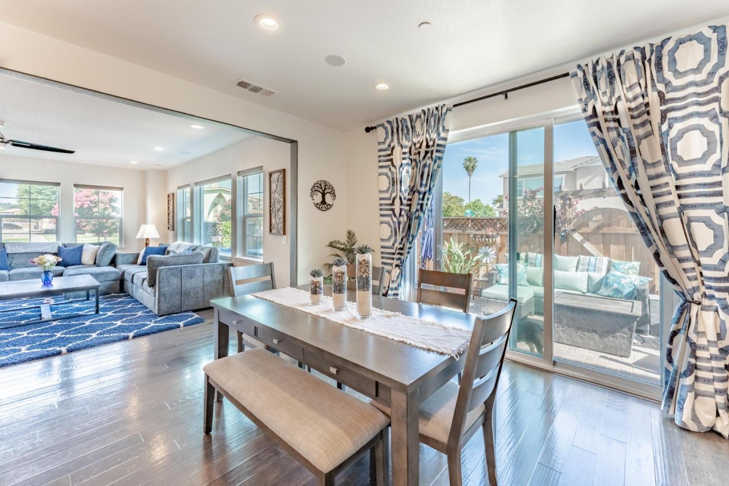 767 Sullivan Way Gilroy, CA 95020 - Photo 9 of 37 a view of a livingroom with furniture wooden floor and a large window