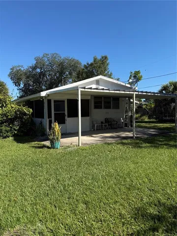 a front view of a house with a garden and porch