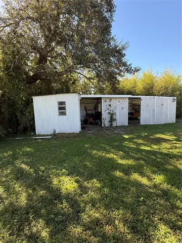 a view of a tiny house with a yard