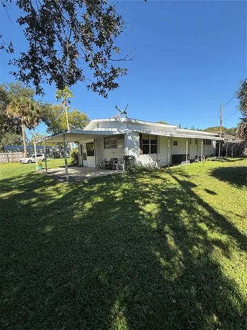 a view of a house with a big yard