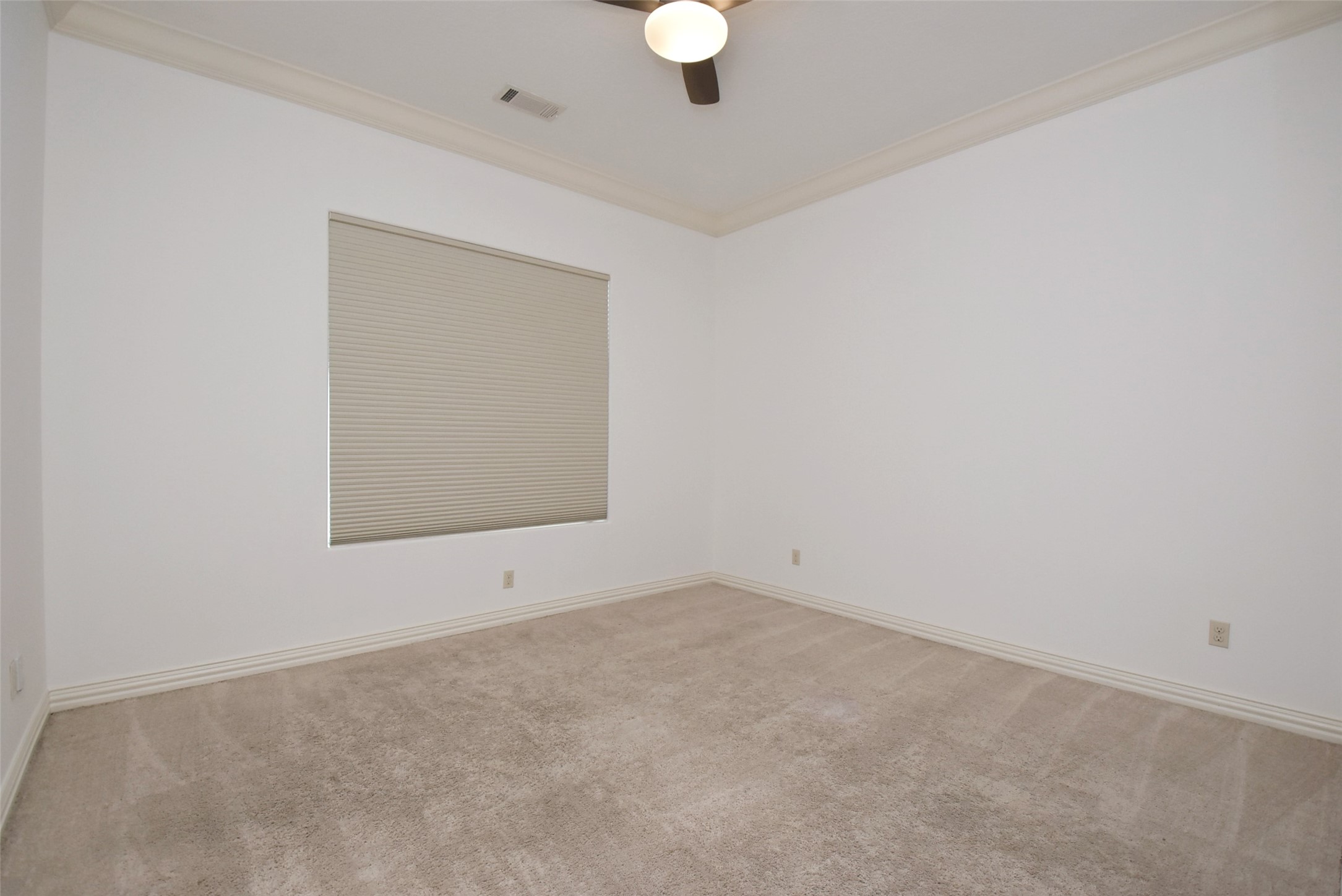 2014 Split Branch Court Houston, TX 77077 - Photo 18 of 47 an empty room with chandelier fan and windows