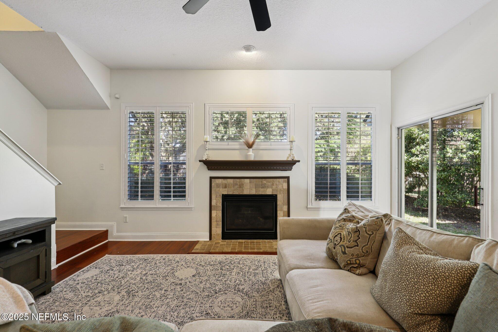 333 Stokes Creek Drive St. Augustine, FL 32095 - Photo 14 of 68 a living room with furniture and a fireplace