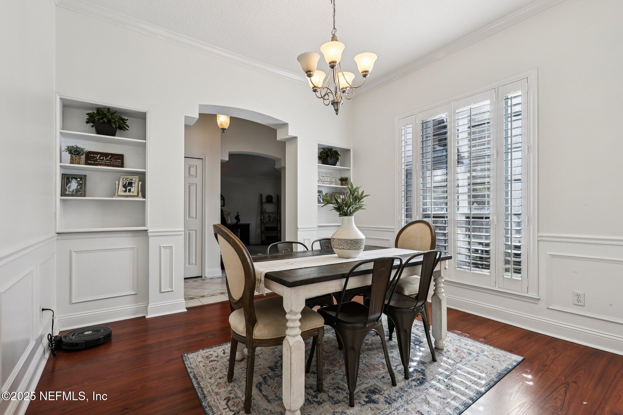 333 Stokes Creek Drive St. Augustine, FL 32095 - Photo 15 of 68 a view of a dining room with furniture window and wooden floor