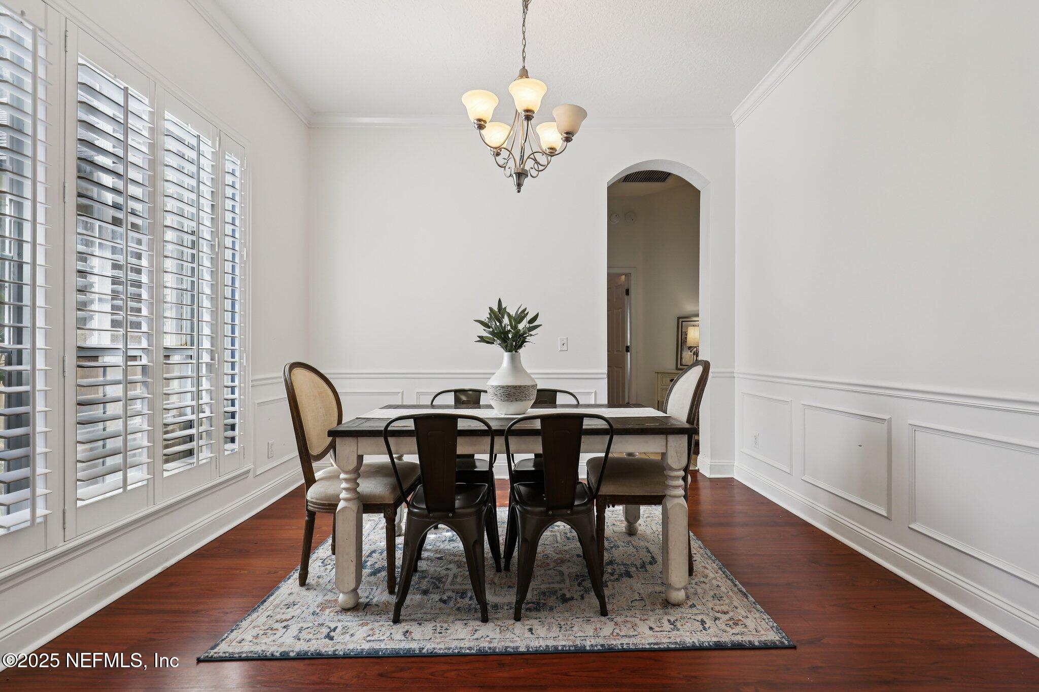 333 Stokes Creek Drive St. Augustine, FL 32095 - Photo 16 of 68 a view of a dining room with furniture window and wooden floor