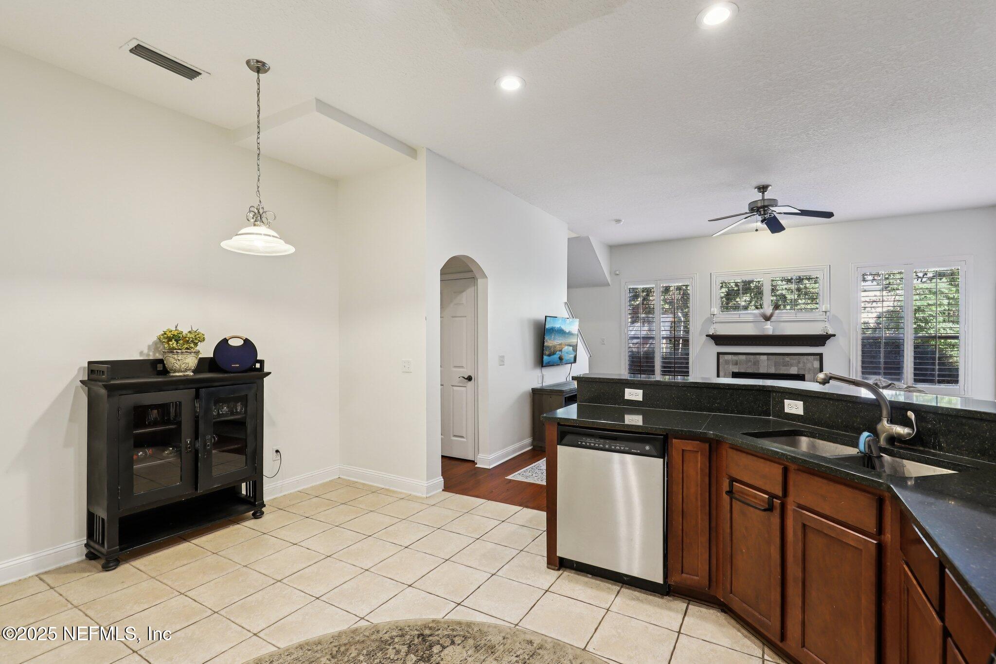 333 Stokes Creek Drive St. Augustine, FL 32095 - Photo 20 of 68 a kitchen with stainless steel appliances granite countertop a stove a sink and a refrigerator