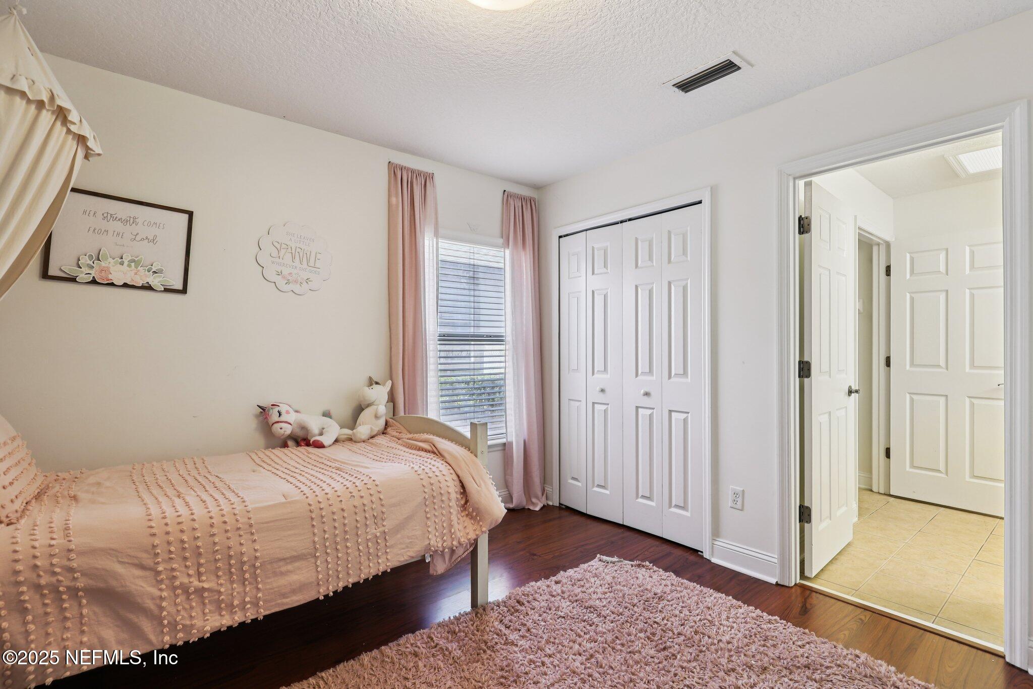 333 Stokes Creek Drive St. Augustine, FL 32095 - Photo 27 of 68 a bedroom with a bed and a window