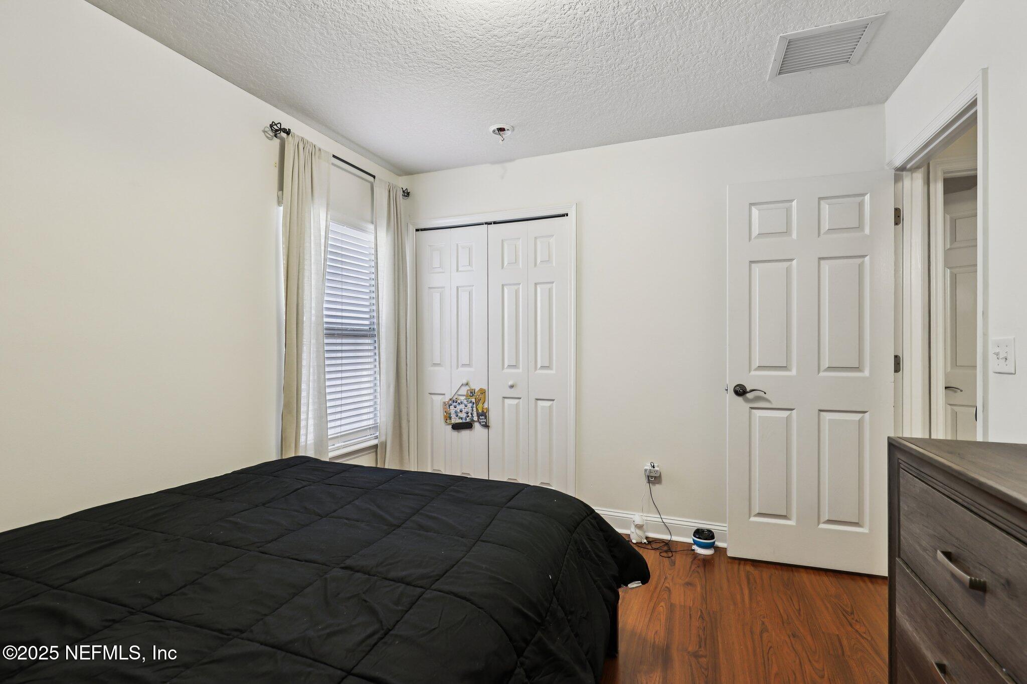 333 Stokes Creek Drive St. Augustine, FL 32095 - Photo 30 of 68 a bedroom with a bed and a window