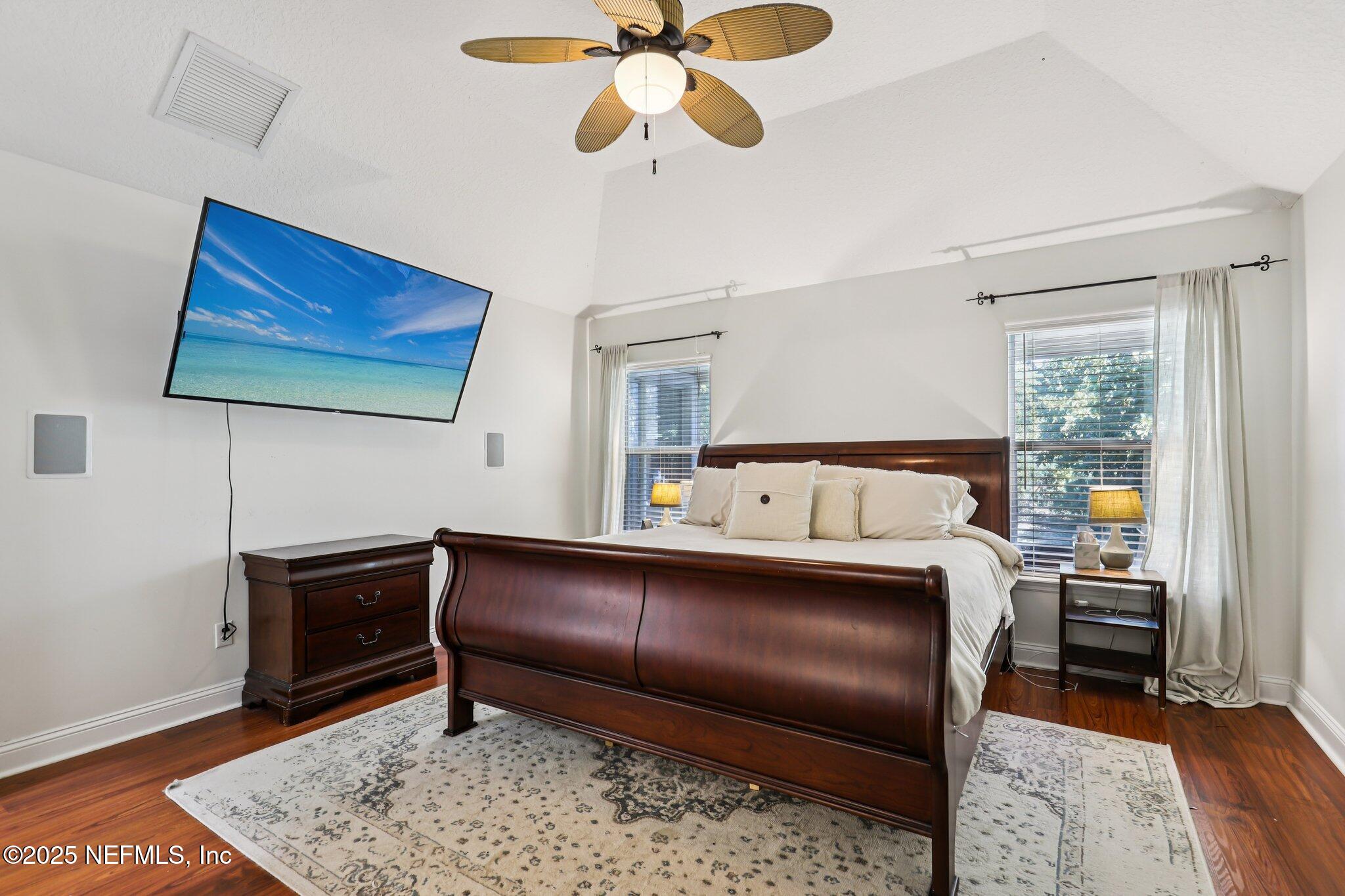 333 Stokes Creek Drive St. Augustine, FL 32095 - Photo 35 of 68 a bedroom with a bed and wooden floor