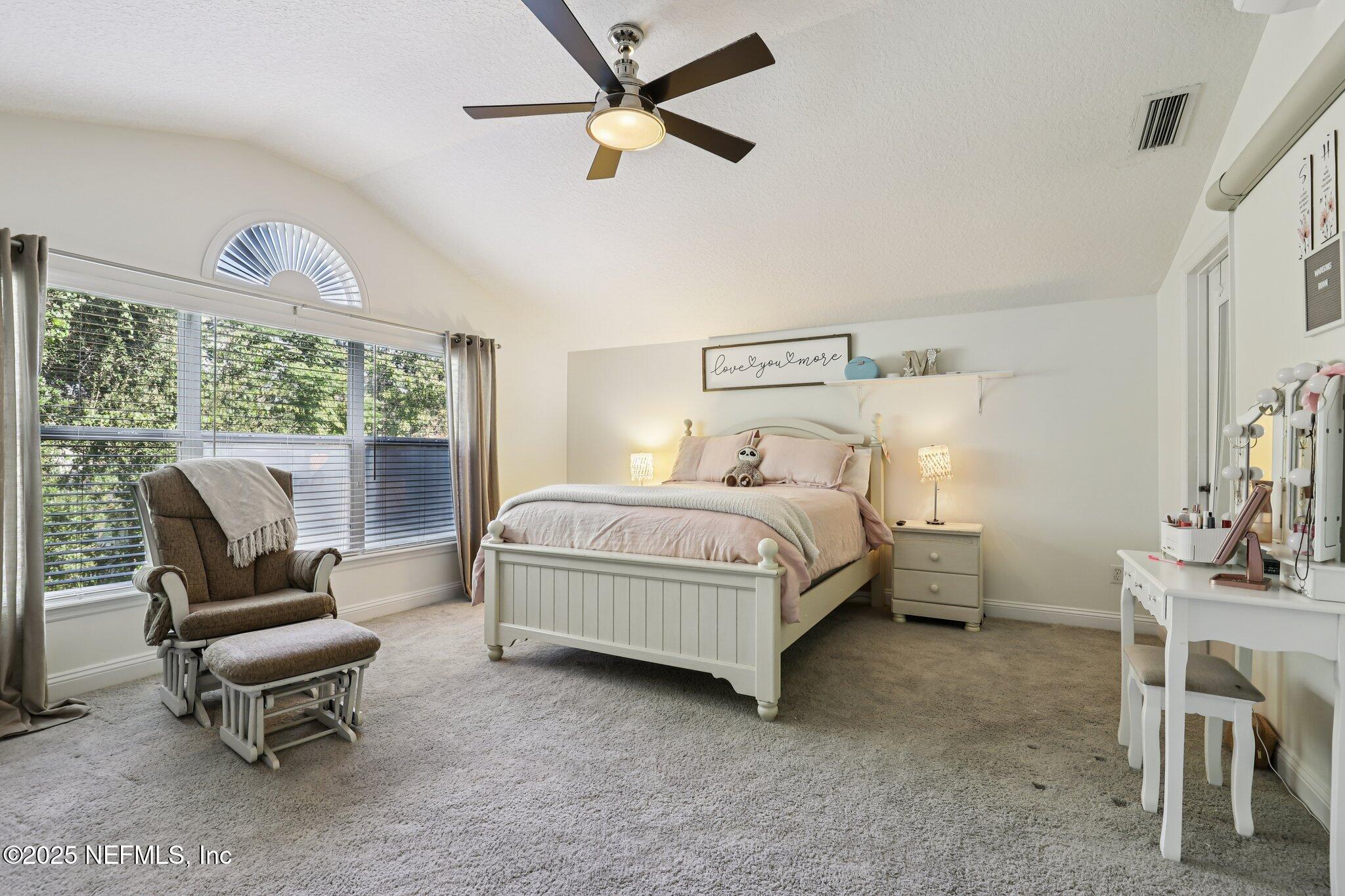 333 Stokes Creek Drive St. Augustine, FL 32095 - Photo 41 of 68 a bedroom with a bed chair and a large window