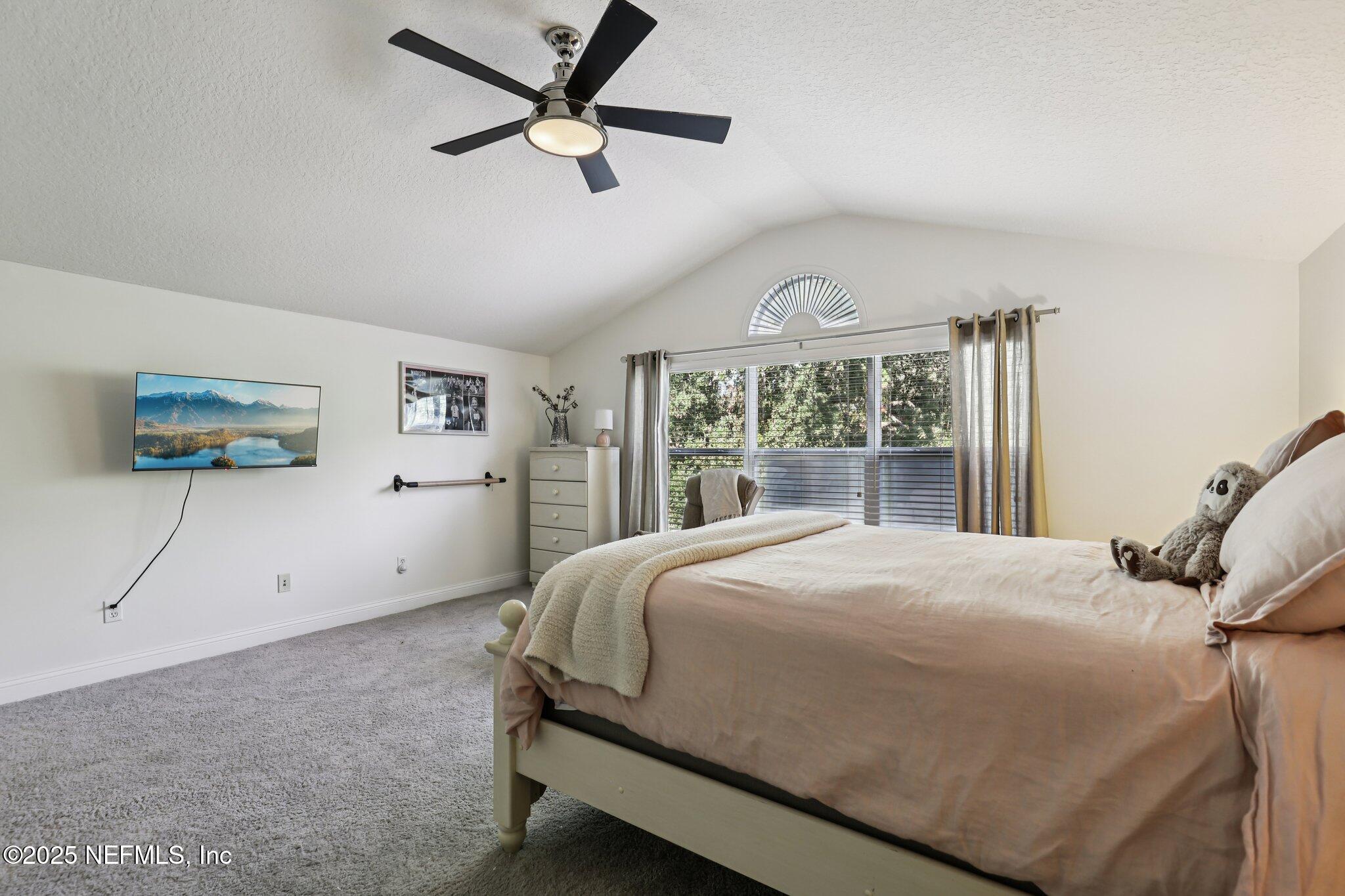 333 Stokes Creek Drive St. Augustine, FL 32095 - Photo 43 of 68 a bedroom with a large bed and a window