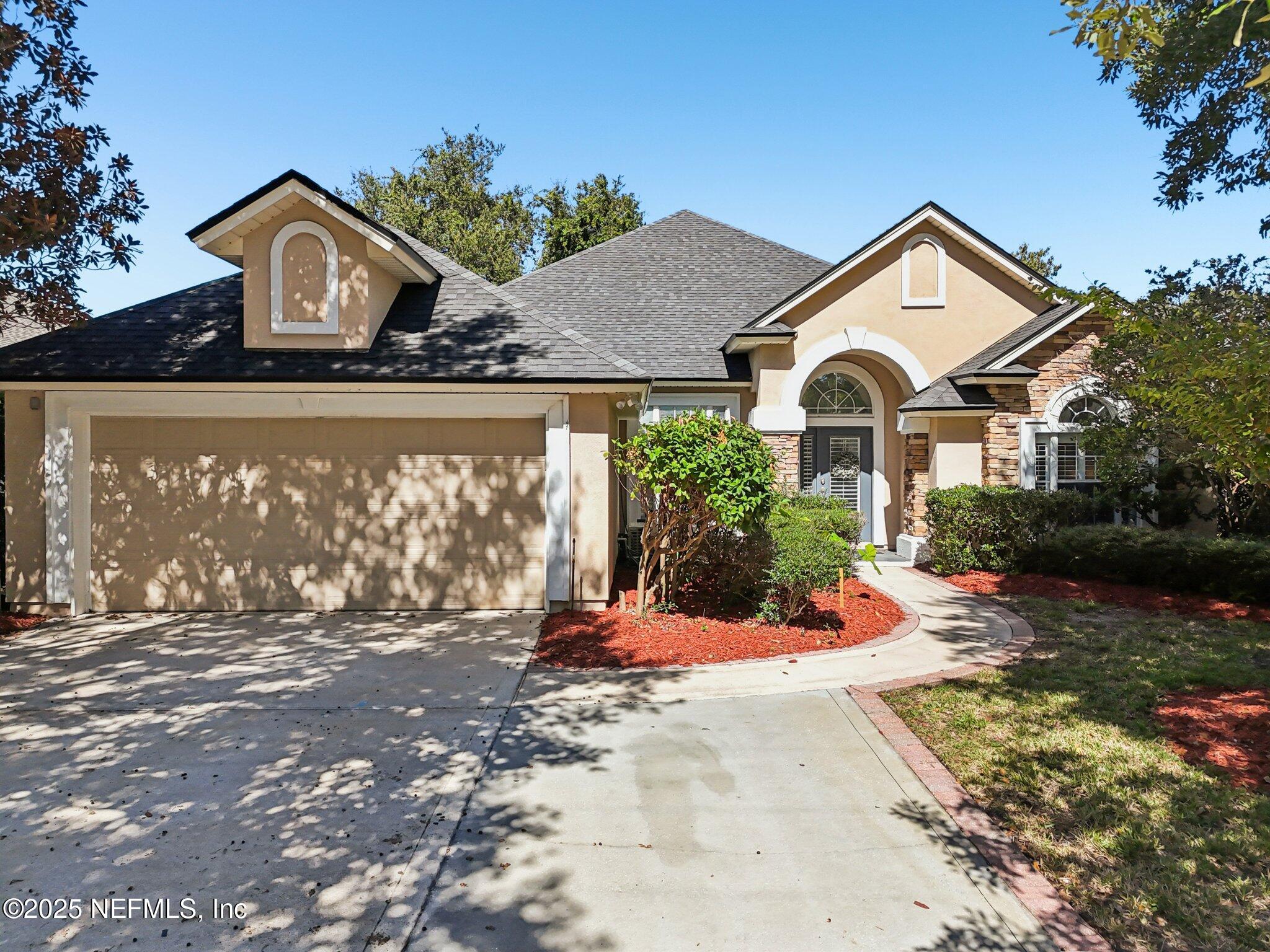 333 Stokes Creek Drive St. Augustine, FL 32095 - Photo 49 of 68 a front view of a house with a yard