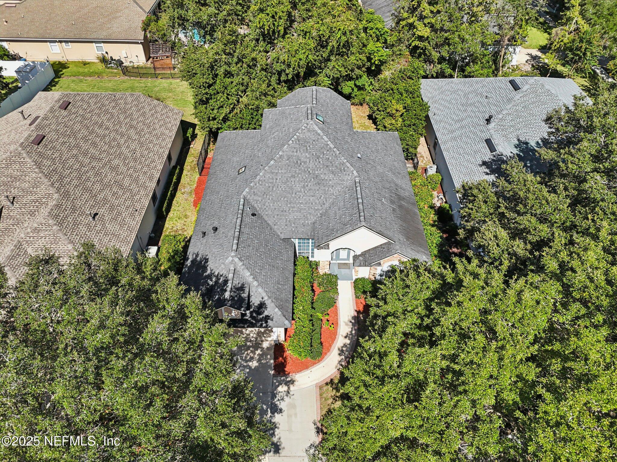 333 Stokes Creek Drive St. Augustine, FL 32095 - Photo 52 of 68 an aerial view of a house with a yard and trees