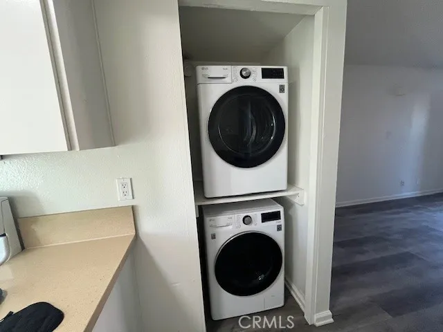 a view of a hallway with washer and dryer