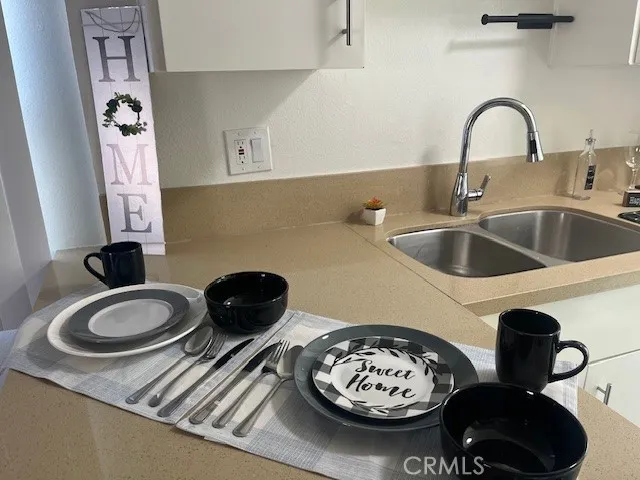 a kitchen with a table and a stove