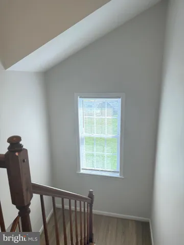 a view of a chair and window in a room