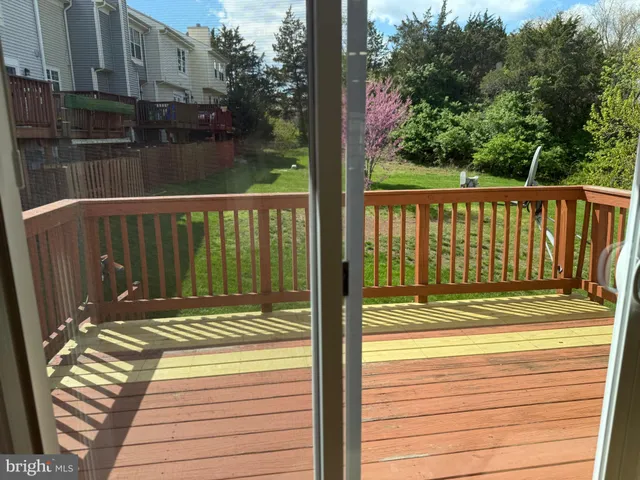 a view of a balcony with wooden floor