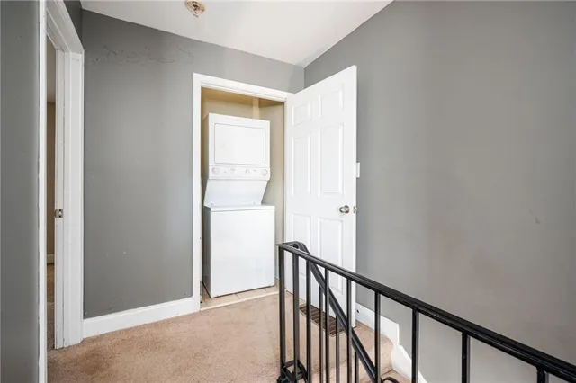 a view of a hallway with a window
