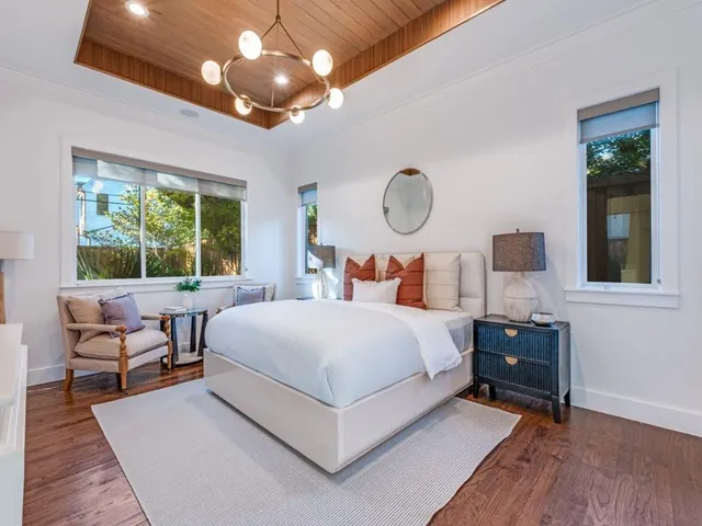 a bedroom with bed and window