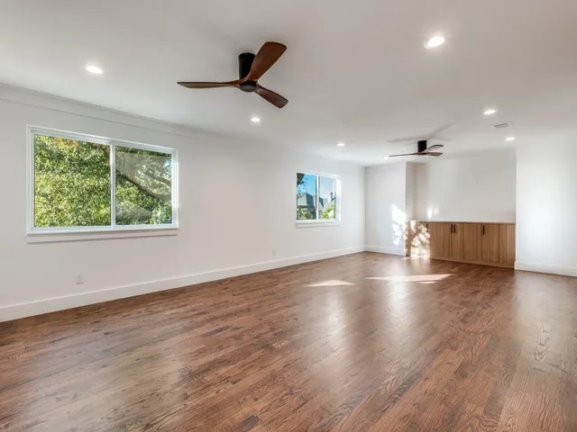 a bathroom with a sink a mirror a vanity and shower