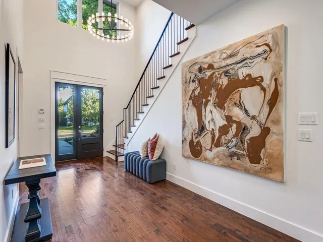 a view of an entryway with wooden floor