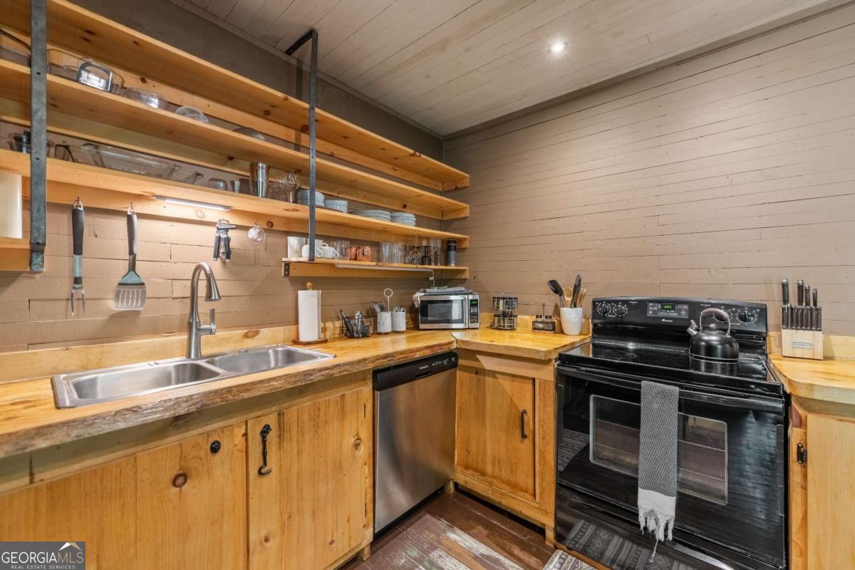 120 Community Hill Drive Blue Ridge, GA 30513 - Photo 16 of 57 a kitchen with stainless steel appliances granite countertop a stove and a sink