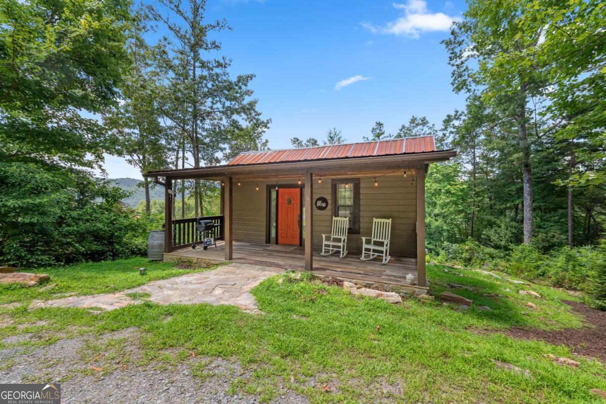 120 Community Hill Drive Blue Ridge, GA 30513 - Photo 3 of 57 a view of a house with backyard porch and sitting area