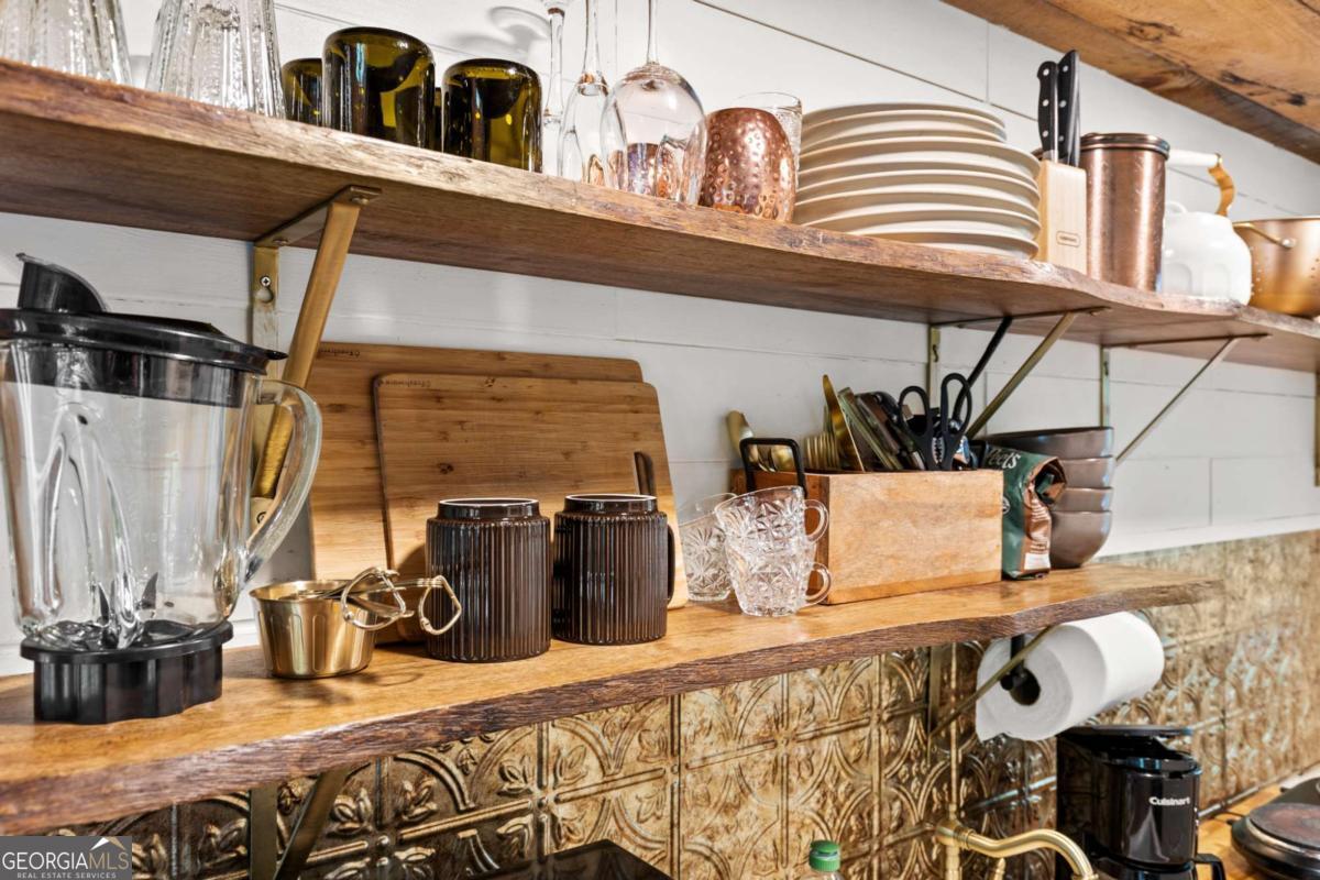 120 Community Hill Drive Blue Ridge, GA 30513 - Photo 37 of 57 a view of a patio with couches chairs and potted plants