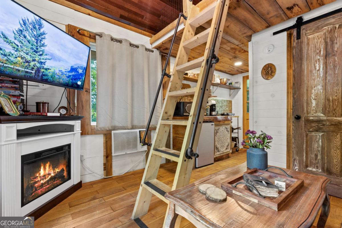 120 Community Hill Drive Blue Ridge, GA 30513 - Photo 41 of 57 a living room with a fireplace furniture and a fireplace
