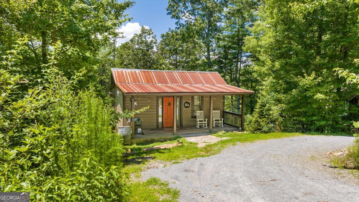 120 Community Hill Drive Blue Ridge, GA 30513 - Photo 7 of 57 a view of a house with garden and sitting area