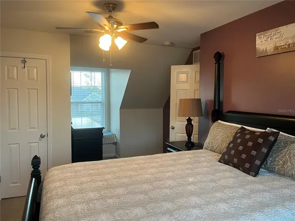 a bedroom with a bed and a dresser