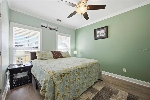 a view of a room with wooden floor