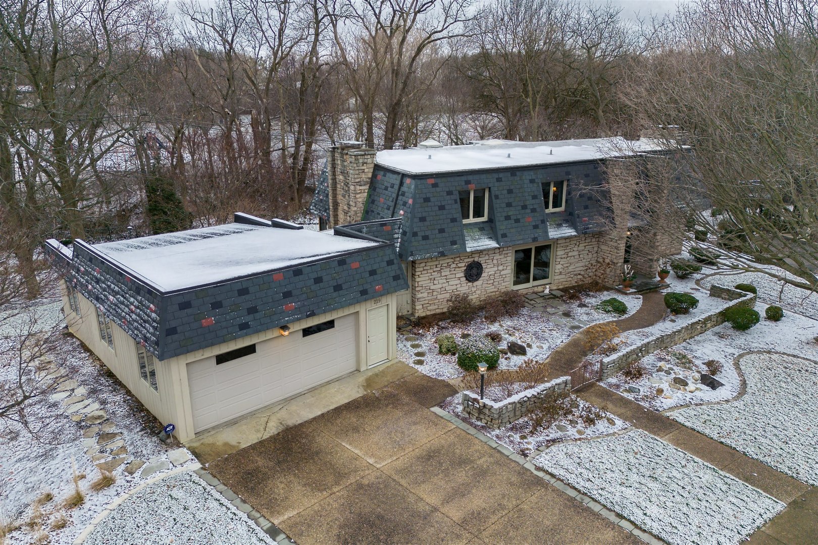 219 Parkview Drive Bloomington, IL 61701 - Photo 15 of 60 a view of a dinning table and chairs in the patio