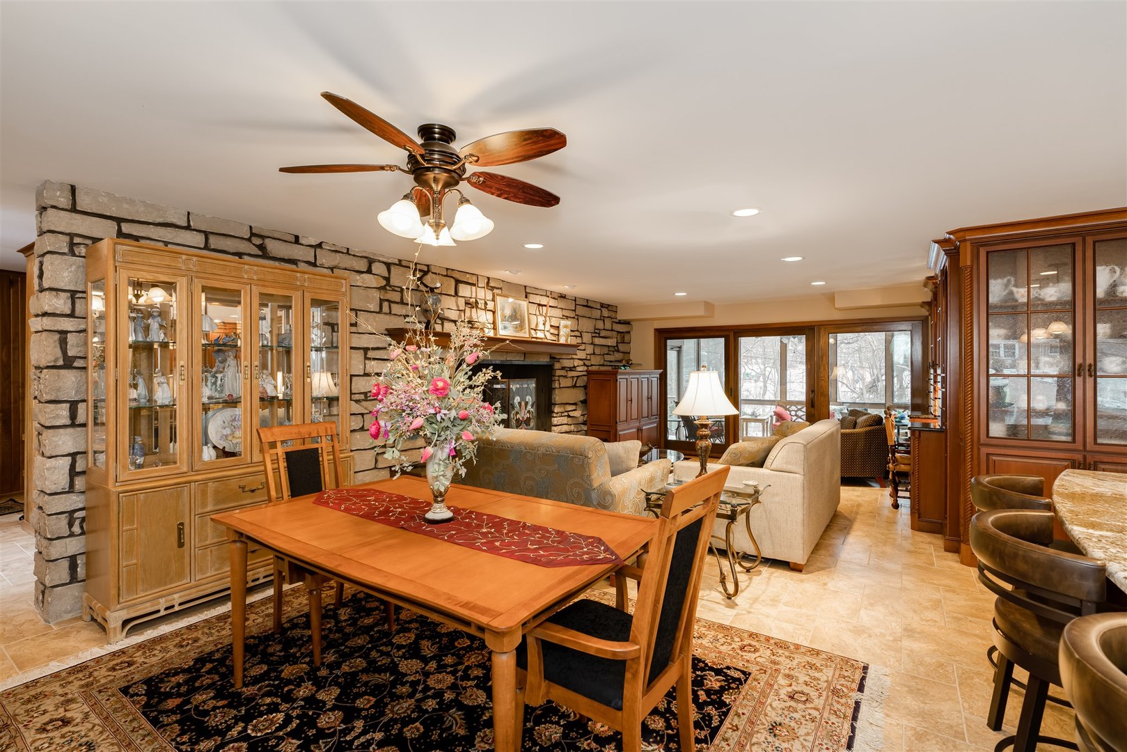 219 Parkview Drive Bloomington, IL 61701 - Photo 19 of 60 a living room with furniture a rug and a chandelier