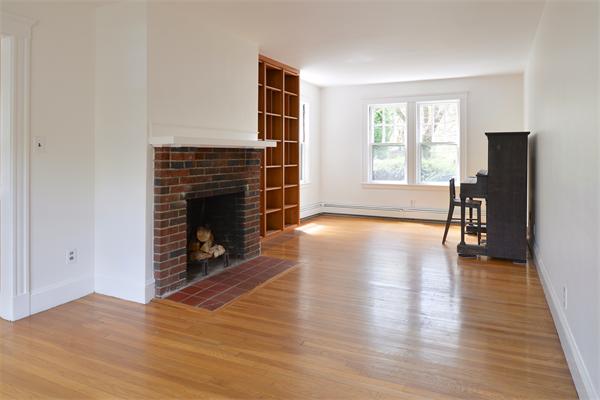 6 Lindbergh Road Marblehead, MA 01945 - Photo 4 of 9 an empty room with windows and a fireplace