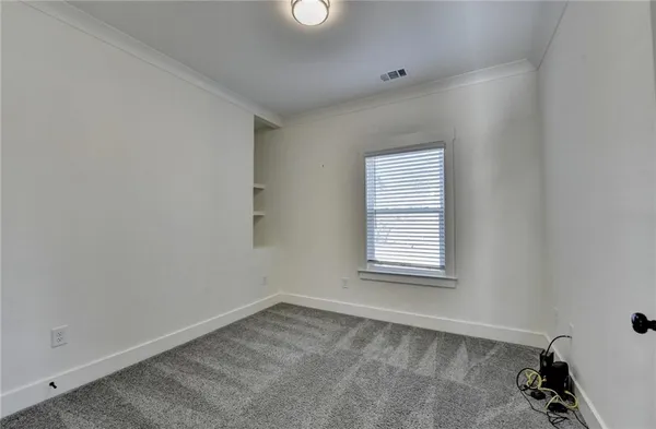 an aerial view of house with yard and outdoor seating