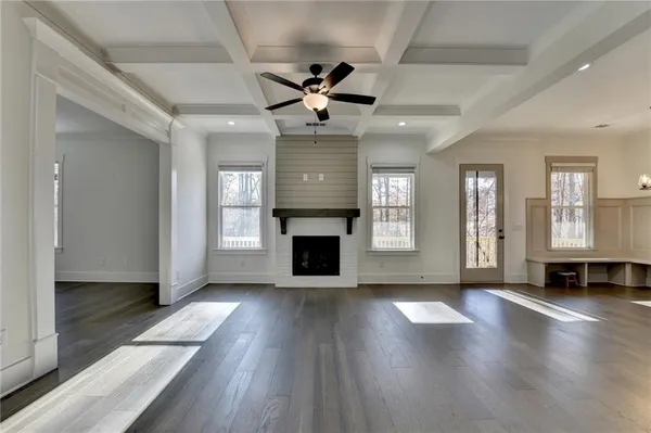 a kitchen with kitchen island stainless steel appliances a sink a stove and a wooden floors