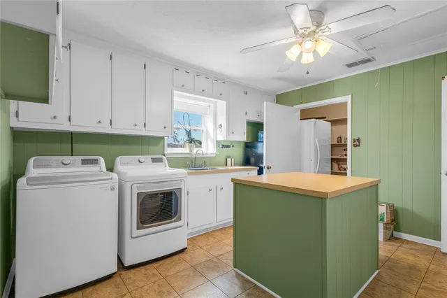 a utility room with washer and dryer