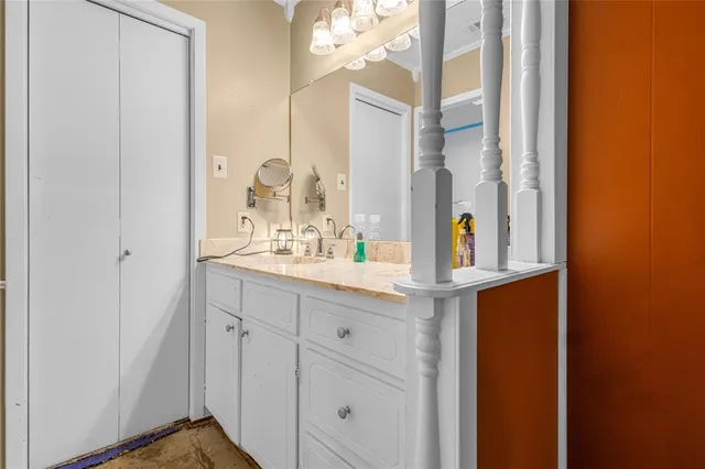 a bathroom with a sink and a mirror