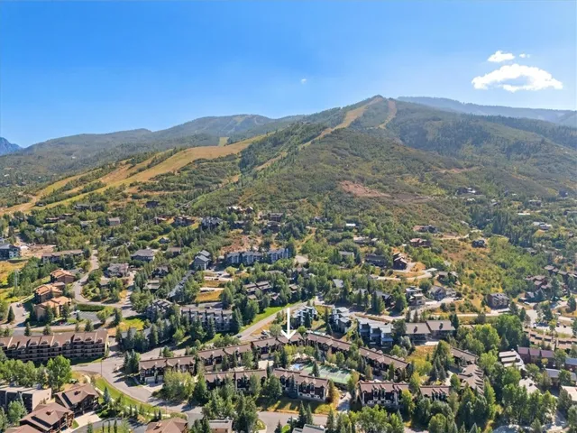 a view of a city with mountains in the background